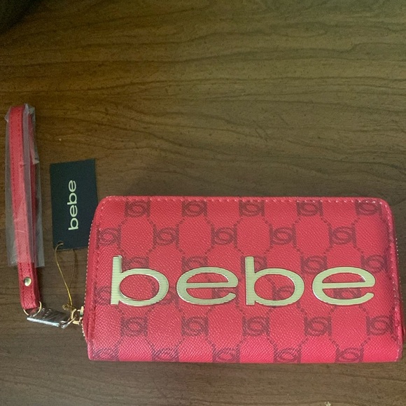 bebe Handbags - NWT BeBe Candy Apple Briella Wristlet